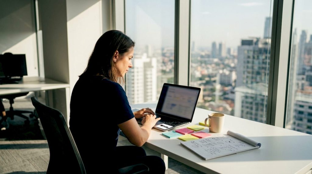 Marketing analyst working on brand analytics dashboard