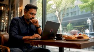 Man working on programmatic ad software at desk